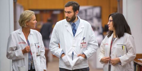 Weill Cornell Medicine physicians walking down hallway.